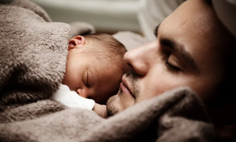 A Sleeping Man and a baby (Courtesy: Pixabay)